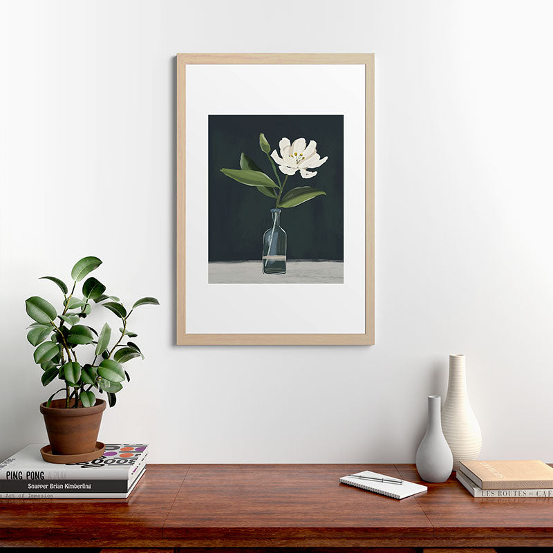 A flower in a vase Framed Art Print