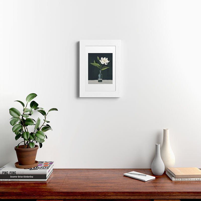 A flower in a vase Framed Art Print