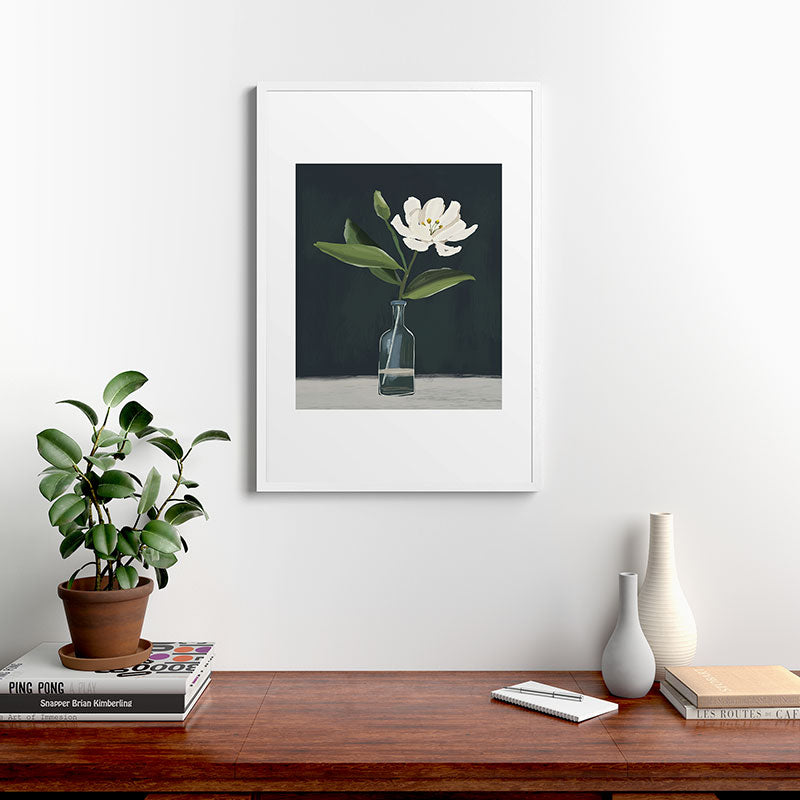 A flower in a vase Framed Art Print