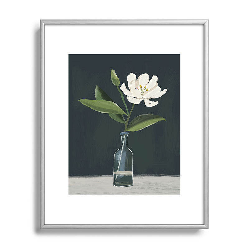 A flower in a vase Framed Art Print