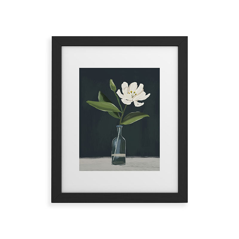 A flower in a vase Framed Art Print