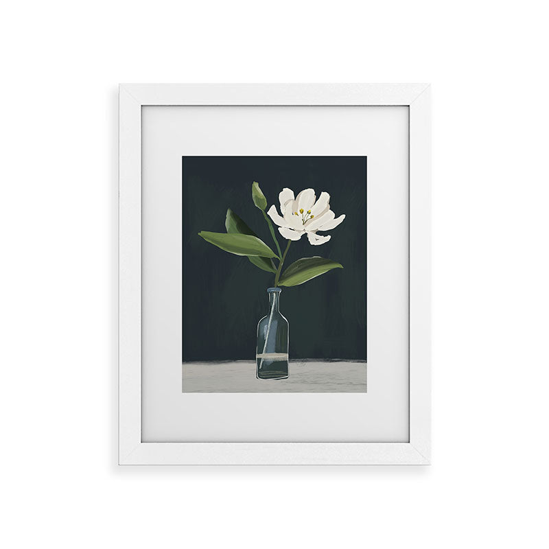A flower in a vase Framed Art Print