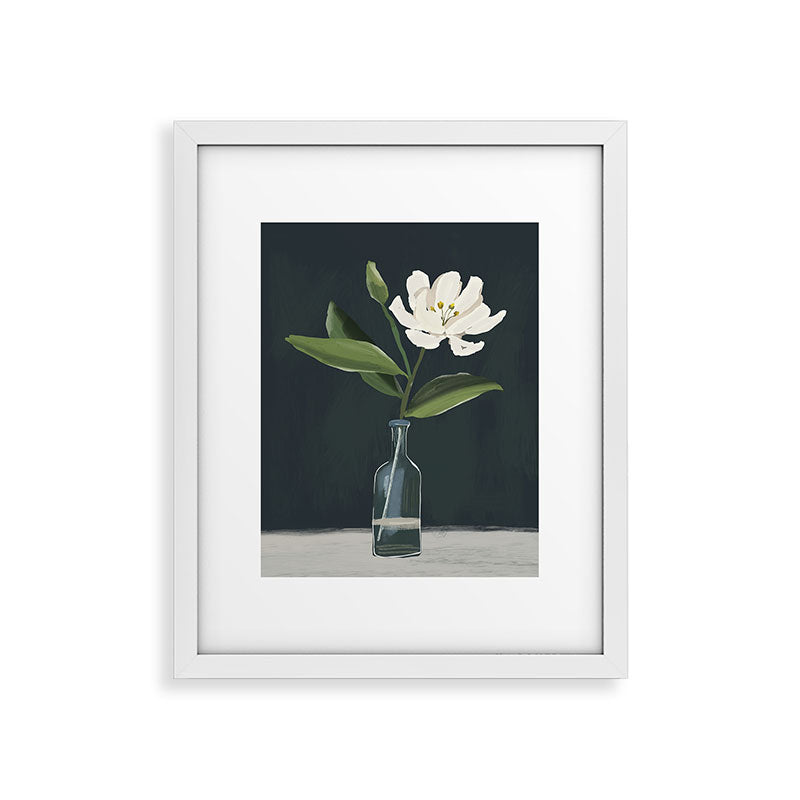 A flower in a vase Framed Art Print